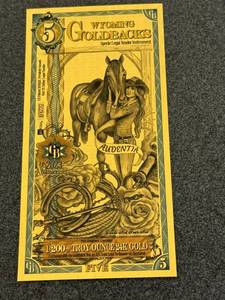 lot 42 image: 1 - Wyoming 5 Goldbacks 1200th troy oz 24K Gold
