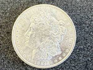 lot 48 image: 1884 O Morgan Silver Dollar
