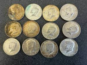 lot 52 image: 12 - Kennedy Half Dollars 1966-1969