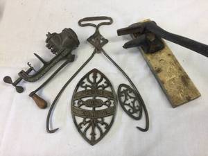 lot 202 image: Antique Iron Trivets - Food Chopper - Meat Grabber - Nut Cracker