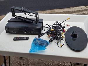 lot 37 image: Magnavox DVDVCR Player with Remote and Cables