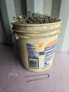lot 57 image: Bucket of Garden Fabric Staples