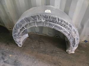 lot 84 image: Pair of Plastic Trailer Fenders with length of approximately 36 inches and a width of about 11 inches