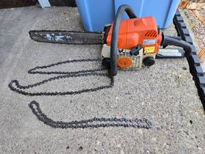 lot 158 image: Stihl Chainsaw with Extra Chains - worked when last used 2 years ago