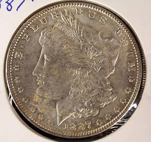 lot 11 image: 1887-P Morgan Silver Dollar MS 65 