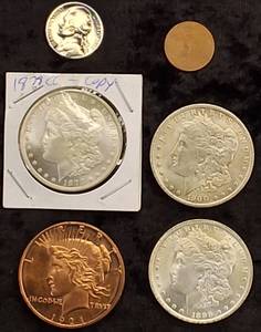 lot 87 image: (3) Morgan Dollar Copys, Nickel Copy, Penny Blank &  One ounce Copper 1921 Peace Dollar