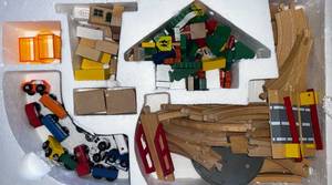 lot 26 image: Melissa & Doug Train Set - Missing some pieces still many there- in new condition with box