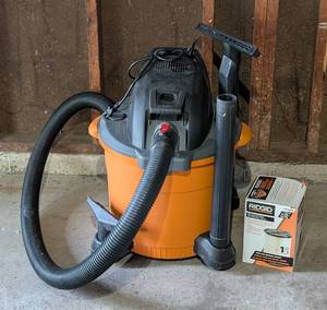lot 120 image: Rigid WetDry Shop Vac and Replacement Filter