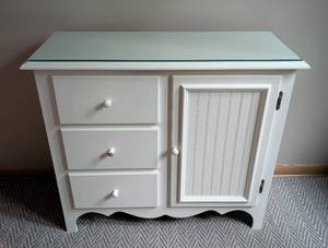 lot 29 image: Glass Topped White Wood Commode Cabinet