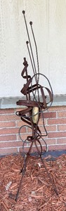 lot 180 image: Abstract Metal Sculpture with Rock Accent 53 Inches Tall