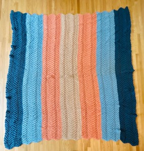lot 95 image: Vintage Hand Knit Blanket 64 x 64 with Colorful Chevron Design