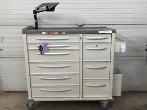 lot 44 image: MSRP $8000 Phoenix LTC Multi-Drawer Medical Medication Cart with Secure Tablet Mount. Durable design with smooth-rolling casters, spacious drawer storage, and a working electronic lock system for added security plus keys Reliable, organized, and mobile.
