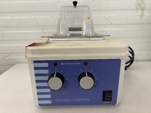 lot 61 image: Barnstead Lab-Line 18050A 2L Water Bath with analog controls, dual thermostats, and overtemperature protection. Seamless stainless steel reservoir, cool-touch exterior, hinged acrylic lid, and dry-run safe design.