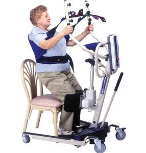 lot 79 image: MSRP $3,500 Invacare Reliant 350 Power Stand-Up Lift w Custom Comfort Sling  Smooth, secure transfers made easy Supports up to 350 lbs, features battery-powered lift, adjustable kneepad, non-slip footplate & low-clearance base. Caregiver fave
