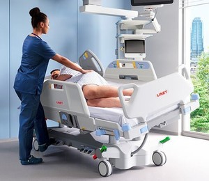 lot 13 image: MSRP $28,000 Linet Multicare ICU Hospital Bed - Tilt Assist, 500lb Cap., Zone Exit Alarm, Scale, Chair Position, Foot Lift & Extension, Patient Hand Control, Ergozone Mattress - Works Excellent