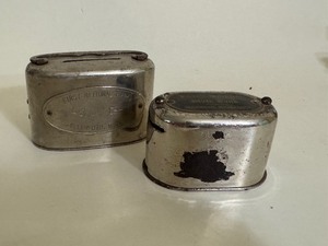 lot 58 image: Antique Metal Coin Bank First National Bank & Farmers-Merchants State Bank