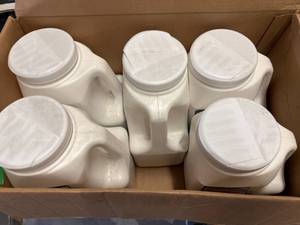 lot 24 image: 5 Jugs of Safe Step 6300 Ice Melter