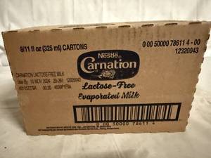 lot 125 image: 8 Cans of Carnation Evaporated Milk