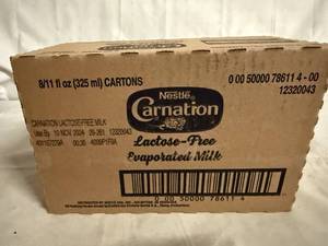 lot 126 image: 8 Cans of Carnation Evaporated Milk