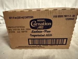 lot 127 image: 8 Cans of Carnation Evaporated Milk