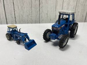 lot A121 image: Two Ford Toy Tractors Ford TW-35 and Front Loader Attachments