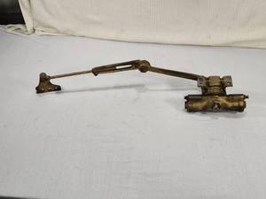 lot 12 image: Norton Door Closer with Arm and Hardware with a patent date of August 26, 1913,