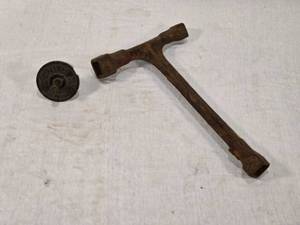 lot 26 image: Zenith Carburetor Part Marked Detroit, USA and a T-Wrench