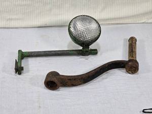 lot 27 image: Cast Iron Crank with Wood Handle and Tractor Light