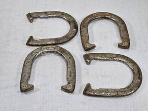 lot 33 image: Four Vintage Spalding Horseshoes