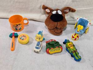 lot 75 image: Variety of Toys and Figurines including Teenage Mutant Ninja Turtles, Flintstones, Scooby Doo and More