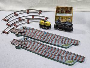 lot 95 image: Vintage Tin Train Set with Tracks with a locomotive marked Central 2241 and a Mobilgas tanker car