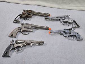 lot 98 image: Lot of Vintage Cap Guns marked with names such as Maverick, Pioneer, and Eagle.