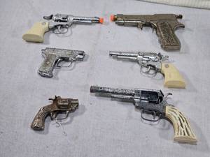 lot 99 image: Vintage Toy Cap Gun Replicas of Classic Revolvers and Pistols