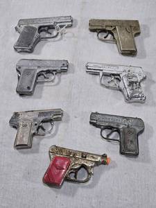 lot 100 image: Lot of Vintage Toy Cap Guns Some have distinctive engravings, such as DETECTIVE and HAWKEYE, DICK