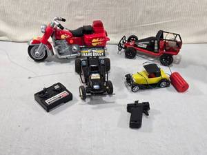 lot 102 image: Toy Remote Control Vehicles and Parts - Tomy Air Jammer, Frame Buggy and Others