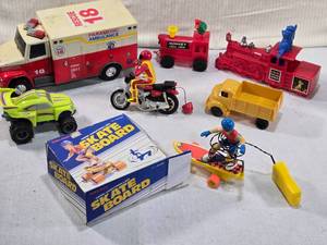 lot 103 image: Vintage Toys Including Ambulance, Trains - 1998 Kidco Matchbox Power Bases, 1980s Radio Shack Skateboarder (only spins 1 directio)