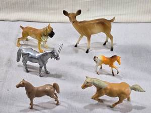 lot 104 image: Lot of Vintage Animal Figurines such as horses, a deer, and a dog