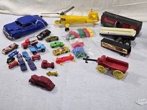 lot 105 image: Toy Vehicles and Accessories including Auburn Rubber Company Buckboard, cars, trucks, helicopter