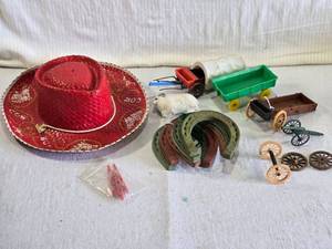 lot 110 image: Lot of Western-Themed Items with Hat, Horseshoes, Wagons