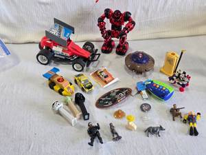 lot 114 image: Variety of Assorted Toys and Collectibles including a red remote-controlled car labeled Bandit 88 (untested)