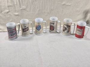 lot 149 image: Lot of Six Vintage Beer Mugs from well-known brands such as Budweiser, Schlitz, Old Style, and Miller Lite