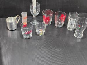 lot 190 image: Various Drinkware with Logos and Designs - Suck em Up Mai Tai Recipe Glass, Absolut Mandrin, Smirnoff Mule and Others