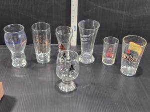 lot 194 image: Beer Glasses with Various Logos from beer brands such as Michelob AmberBock, Blatz, and Caldbecks Golden Lager