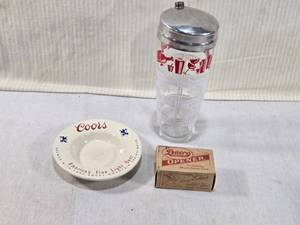 lot 205 image: Vintage Coors Ashtray, Cocktail Glass Shaker, and Dacro Opener