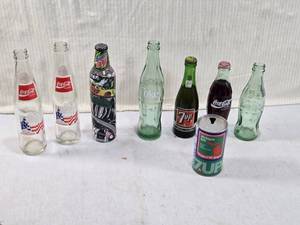 lot 217 image: Lot of Vintage Soda Bottles and Cans - 7up with Contents, Coca-Cola with Contents, Mountain Dew with Contents
