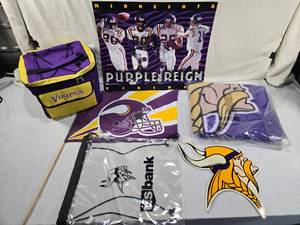 lot 253 image: Minnesota Vikings Fan Items cooler bag, a poster titled Purple Reign with images of players, a flag with the teams helmet logo, a clear backpack branded with US Bank Stadium, a blanket with the Vikings logo, and a Viking head decal