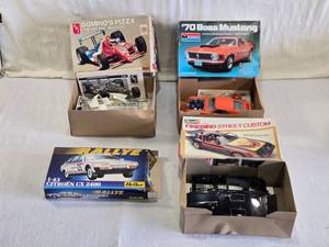 lot 267 image: Model Car Kits 1970 Boss Mustang, a Revell Firebird Street Custom, an AMT Dominos Pizza race car, and a Heller Citron CX 2400 - Some Partially Assembled, Parts Not Counted