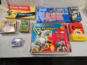 lot 275 image: Vintage Board Games - Lone Ranger, The Six Million Dollar Man, Tiddly Winks and Lucky Shot, Blockhead, Euchre, Pocket Solitaire, Cootie, and Boggle.