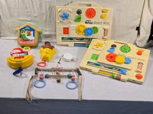 lot 283 image: Lot of Vintage Musical and Activity Toys including Playskool Musical Busy Boxes, a Kiddicraft toy, and a Childhood Interests Cradle Gym.