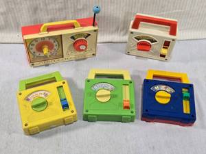lot 287 image: Fisher-Price Music Box Toys Lets Go Fly a Kite, Toyland, Hickory Dickory Dock, and The Teddy Bears Picnic.